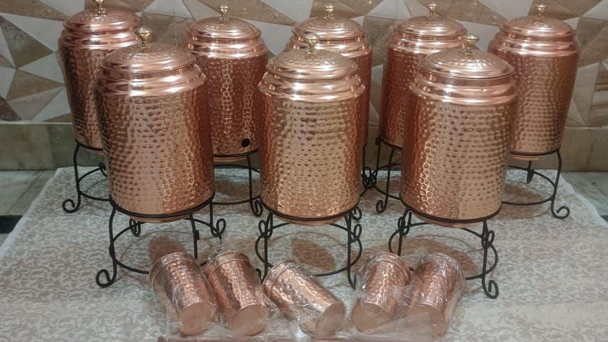 Set of copper kitchen items including pots and connectors