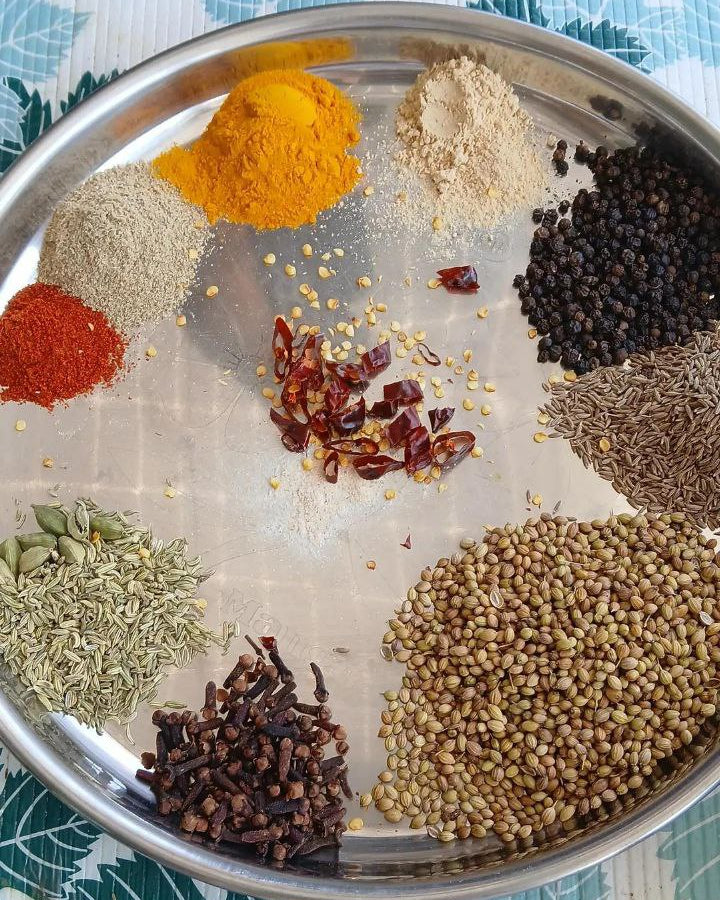 Assorted spices on a metal tray 